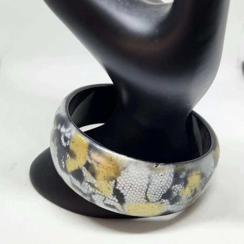 Gold, black and white Bangle